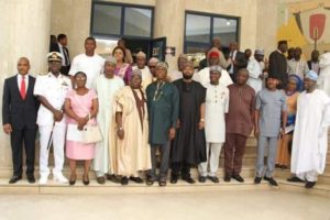 The Minister flanked by Board members