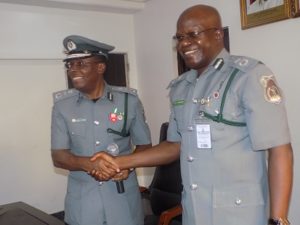 ACG Charles Edike and CAC, Bashar Yusuf in warm hand shake for job well done