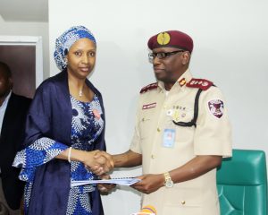 MD of NPA, Hadiza Bala Usman (left) and the Corp Marshal of Federal Road Safety Corps (FRSC), Dr. Boboye Oyeyemi exchanging copies of the MOU between both organizations at the corporate headquarters of NPA in Marina, Lagos.