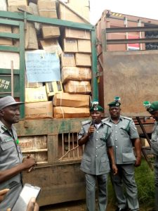 Comptroller FOU Zone A, Mohammed Uba Garba showing some of the seized items